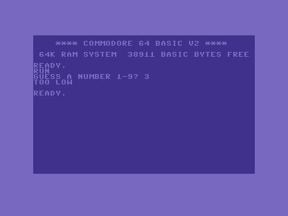 The C64 screen showing GUESS A NUMBER 1-9? 3, then TOO LOW.