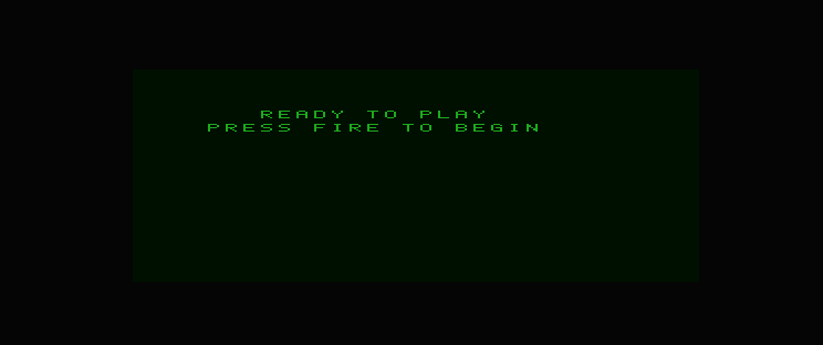 An original READY TO PLAY prompt and PRESS FIRE TO BEGIN line centred within the declared panel on Dragon 32 PMODE 4.