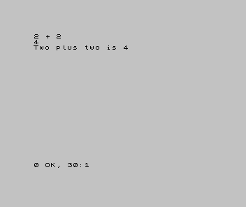 A Spectrum screen showing three lines: 2 + 2, then 4, then Two plus two is 4.