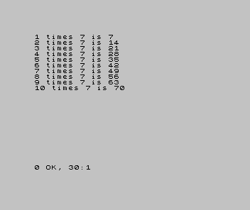 A Spectrum screen showing the seven times table: 1 times 7 is 7, up to 10 times 7 is 70.