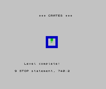A crate pushed onto a target has turned green, with the player just below it