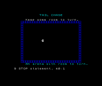 An original white directional face inside a blue brick arena on the Spectrum screen.