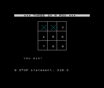 ZX Spectrum Three in a Row: two cyan crosses in the top row, the third cell just played, and the message You win!