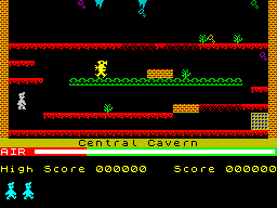 Central Cavern, with Willy on the left, platforms above and below, items, a moving guardian and the exit at the lower right