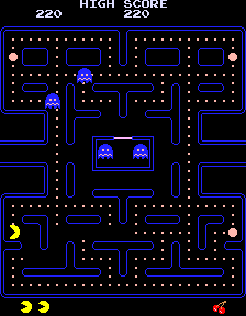 After a lower-left power pellet is eaten, the ghosts are blue and Pac-Man is beside the cleared pellet position