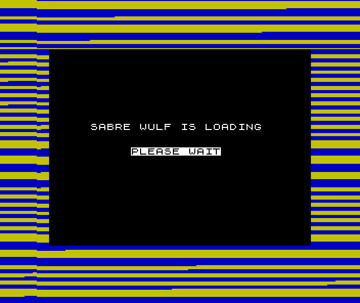 A ZX Spectrum mid-load: the screen is black except for the words SABRE WULF IS LOADING and PLEASE WAIT, surrounded by a thick border of horizontal blue and yellow stripes.